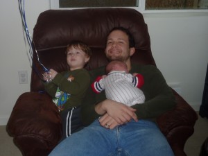 The boys all together in the rocking chair.