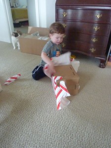 Elias opening his present.