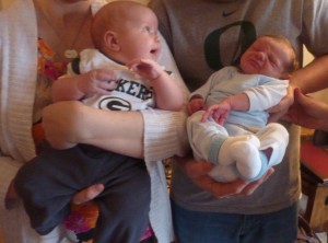 Simon and Ethan's first meeting. Simon looks so much bigger than Ethan, but they are only two weeks and five days apart! 