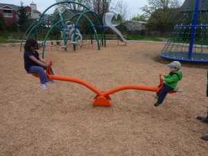 Elias' first ride on a teeter totter.