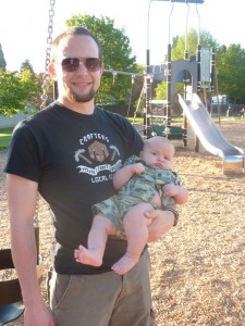 Nathan holding Simon while I pushed Elias on the swing.