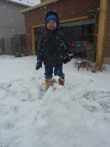 The snow didn't stick together so when Elias wanted to build Frosty the snowman, this is what we got. A snow mountain with some arms and a face. But he was excited and proud...and that is what matters.